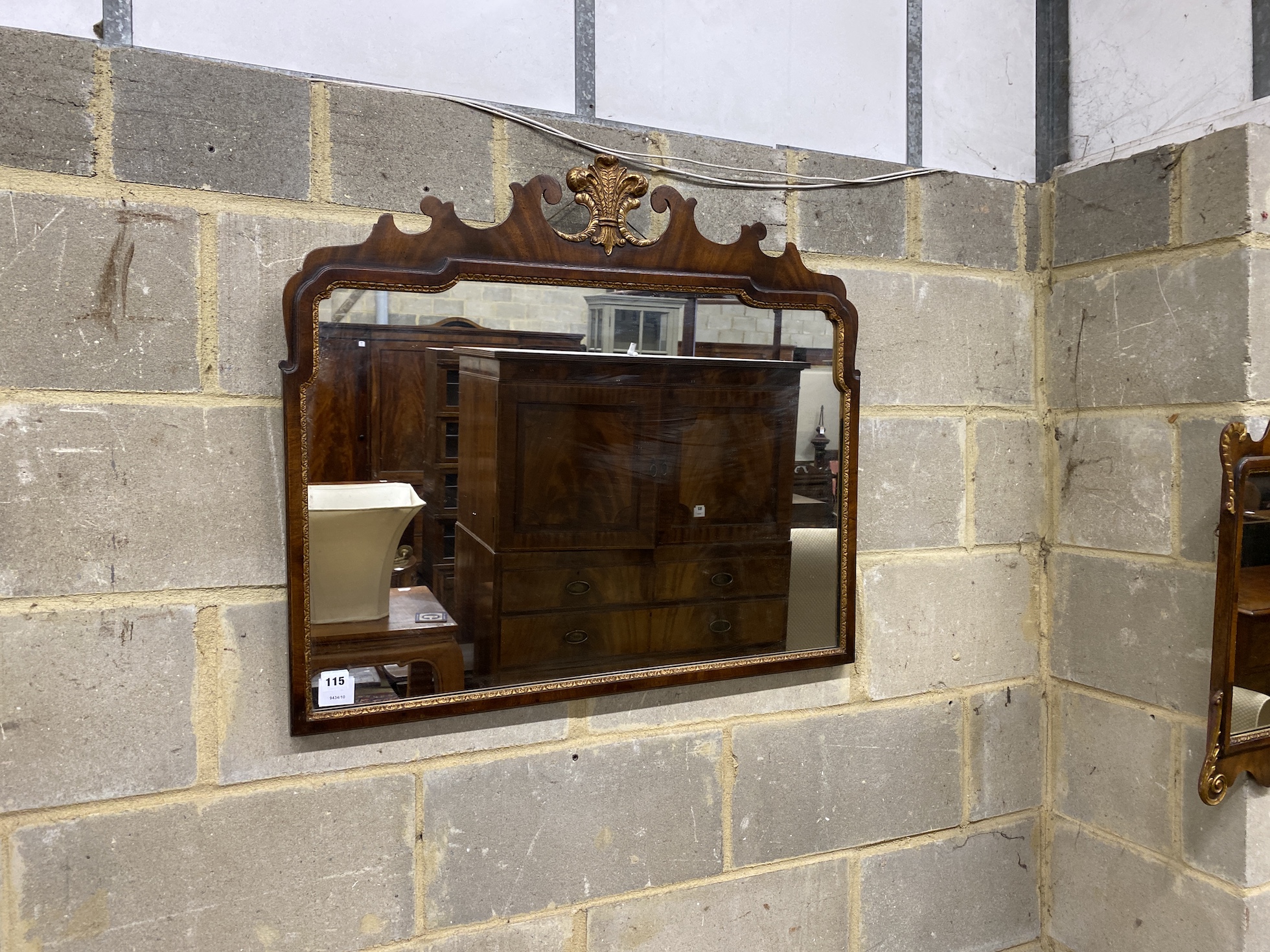 A Queen Anne style parcel gilt fret cut wall mirror, with gilt fleur de lys surmount, together with another, larger width 82cm, height 71cm